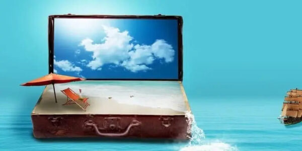 suitcase on light blue backround with sand and umbrella inside